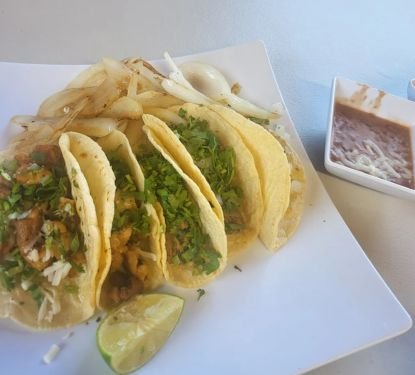 Fresh tacos served with lime