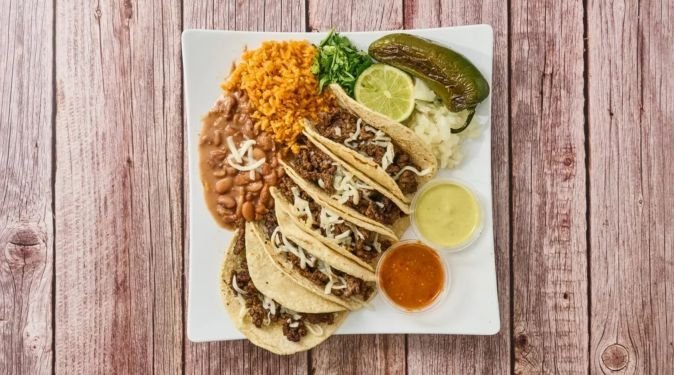 Taco plate with rice, beans, grilled jalapeño and salsa